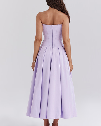 Back view of a women's lavender strapless boned bodice pleated midi dress with zipper detail