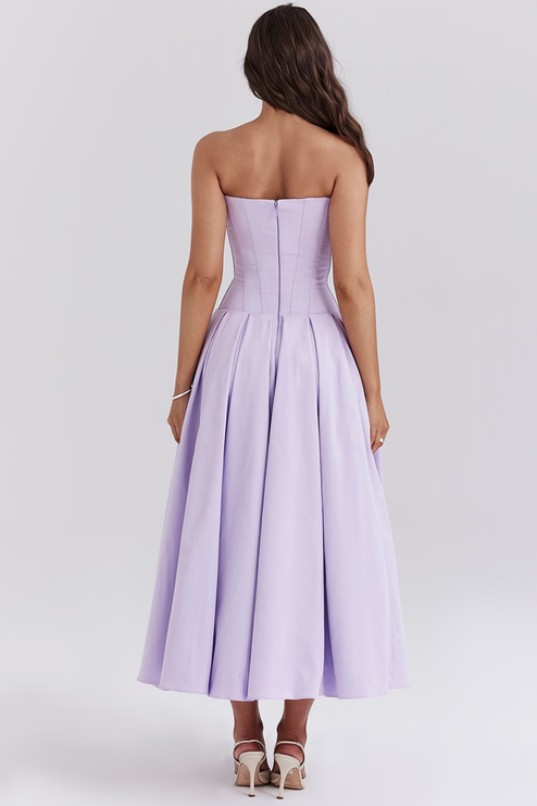 Back view of a women's lavender strapless boned bodice pleated midi dress with zipper detail