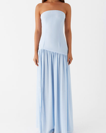Front view of a light blue strapless maxi dress with a ruffled hemline and elegant drape.