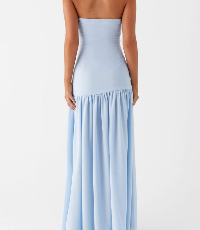Back view of the light blue strapless maxi dress, showing the smooth fabric and ruffled detail.