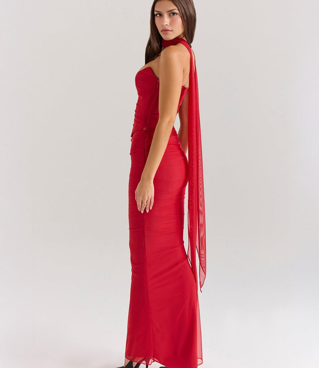 Back side view of vibrant red strapless mesh ruched maxi dress with long sheer train