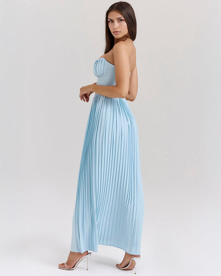 Three-quarter back view of a light blue pleated maxi dress, highlighting the delicate pleating and the dress's silhouette.