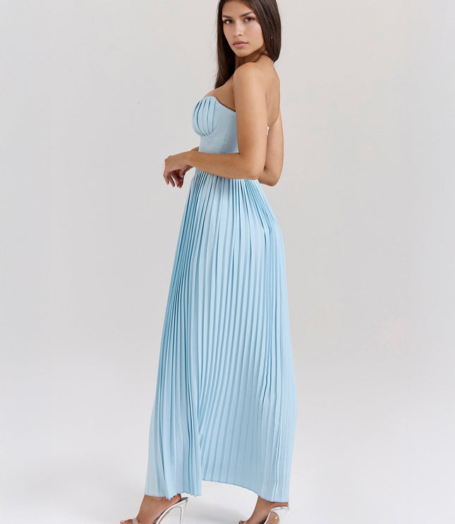 Three-quarter back view of a light blue pleated maxi dress, highlighting the delicate pleating and the dress's silhouette.
