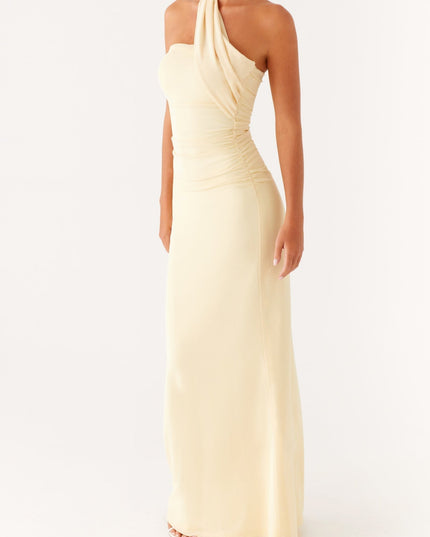 Angled front view of a women's pale yellow strapless maxi dress with a ruched bodice and neck scarf.