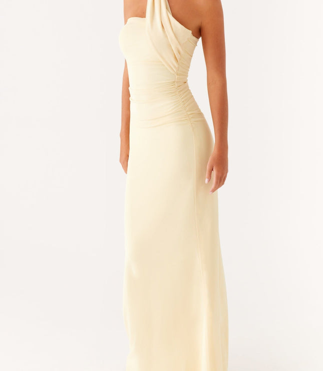 Angled front view of a women's pale yellow strapless maxi dress with a ruched bodice and neck scarf.