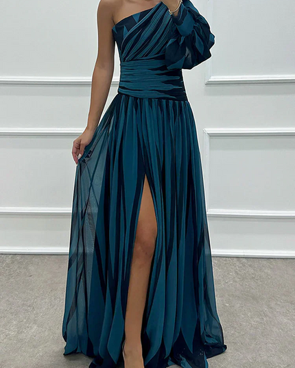 Teal and black striped one-shoulder maxi dress with a flowy skirt, high slit, and ruched bodice