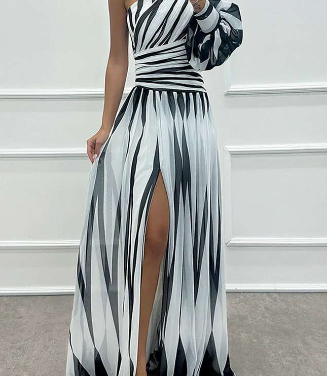 Women's black and white striped one-shoulder maxi dress with a high slit and long puff sleeve