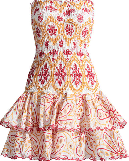 Flat lay front view of a white strapless mini dress featuring red and orange embroidered designs and a layered tiered skirt.