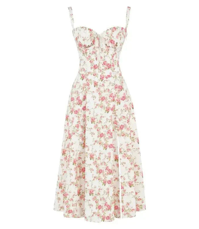 Flat lay of a white floral corset bow front midi dress adorned with vibrant pink rose patterns.
