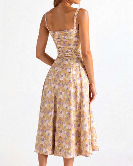Back view of the yellow floral corset midi dress, showing the shirred back and flowy skirt.