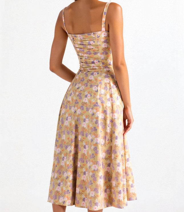 Back view of the yellow floral corset midi dress, showing the shirred back and flowy skirt.