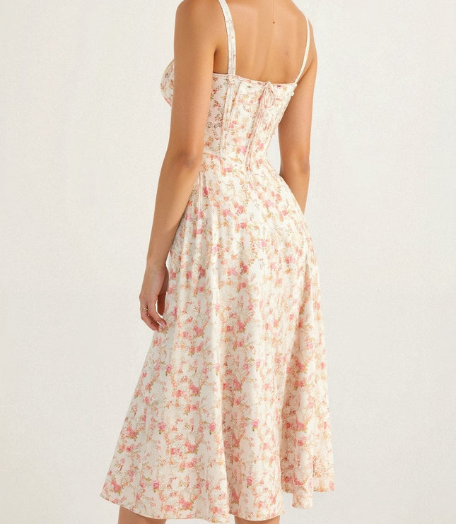 Back view of the white floral corset midi dress with pink blooms, showcasing the delicate pattern.