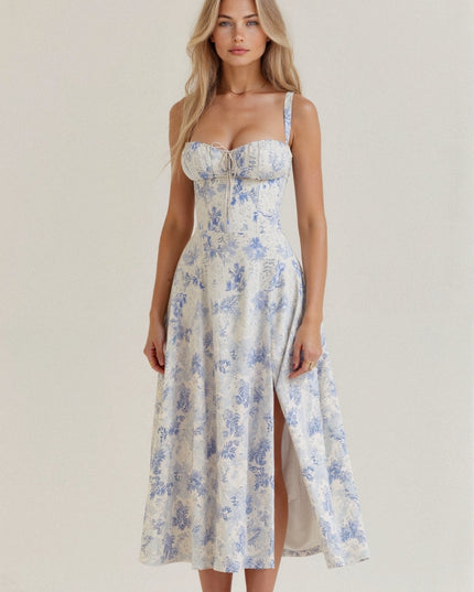Front view of a white and light blue floral corset bow front midi dress with a side slit.