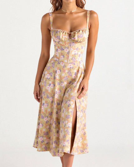 Front view of a yellow floral corset midi dress with a bow front and side slit, for summer.