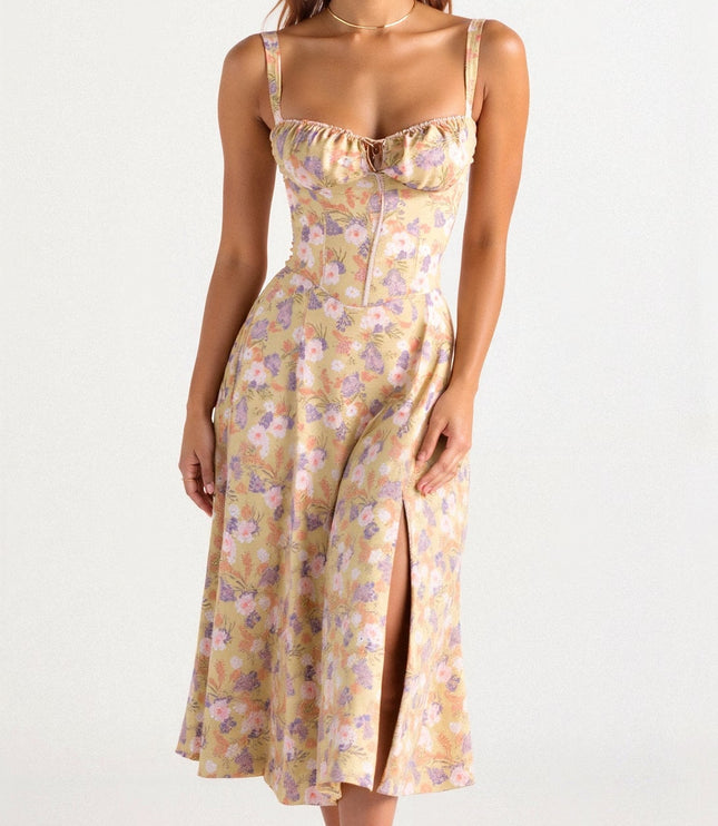 Front view of a yellow floral corset midi dress with a bow front and side slit, for summer.
