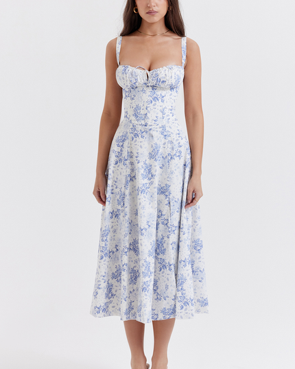 Full-length view of a women's white summer midi dress with blue floral print and sweetheart neckline