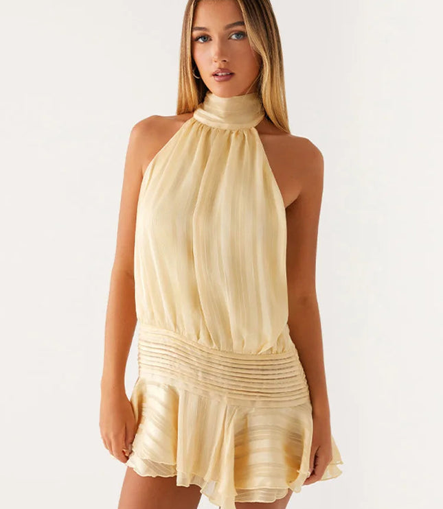 Front view of a light yellow halter neck mini dress with subtle vertical stripes and a ruched waist, for summer.