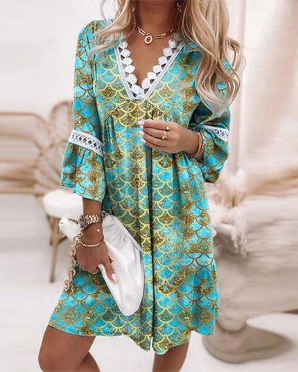 Women's summer mini dress featuring a unique blue and gold scale pattern, V-neck, and lace trim.