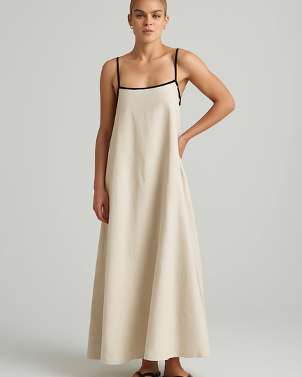 Light beige women's summer maxi dress with thin black spaghetti straps and square neck design.