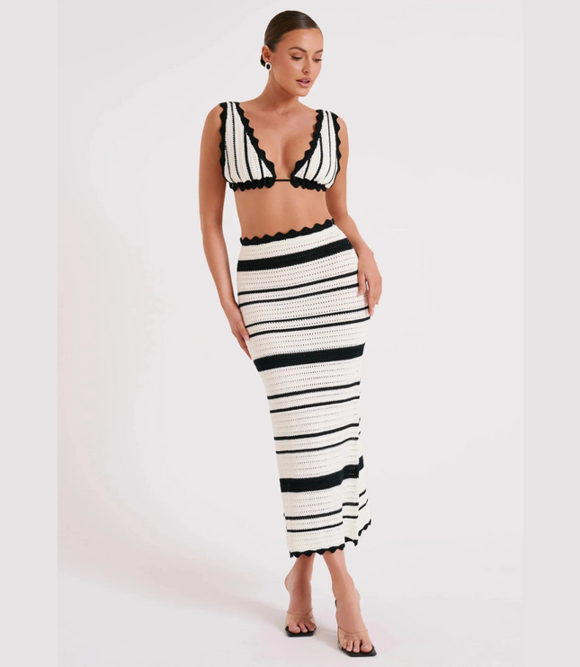 Women's summer striped crochet two piece maxi set featuring a black and white striped crop top and matching maxi skirt with scalloped edges.