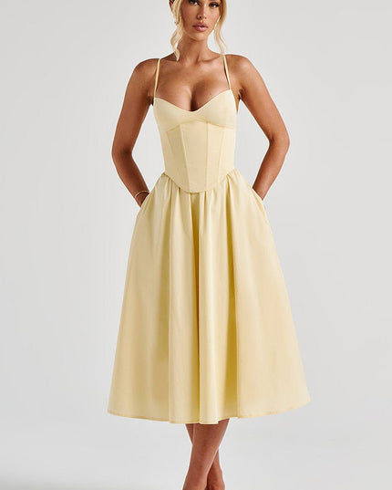 Light yellow sweetheart corset midi dress with spaghetti straps, featuring a full skirt and discreet pockets.