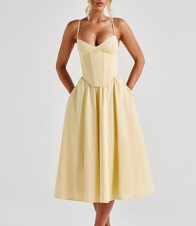 Light yellow sweetheart corset midi dress with spaghetti straps, featuring a full skirt and discreet pockets.