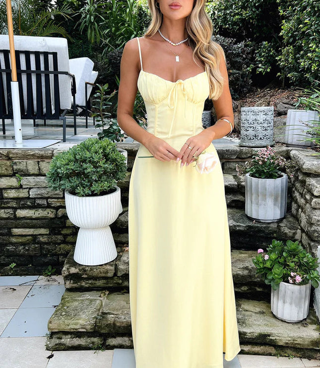 Elegant yellow summer maxi dress for women, featuring a tie-front bust, structured bodice, and a long, flowing skirt.
