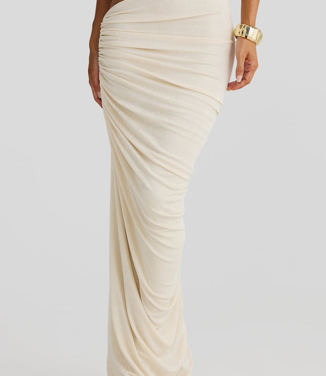 Close-up of the draped off-white maxi skirt from the two-piece set, highlighting the side cut-out and ruched fabric texture.
