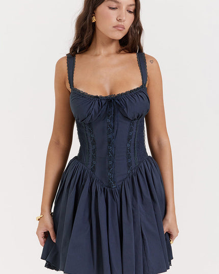 Front view of a navy sweetheart neck mini dress with lace-up corset details and ruffled shoulder straps.