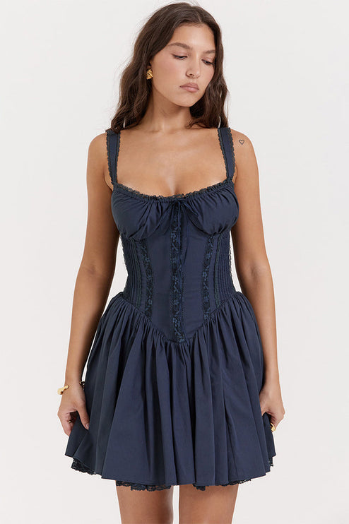 Front view of a navy sweetheart neck mini dress with lace-up corset details and ruffled shoulder straps.