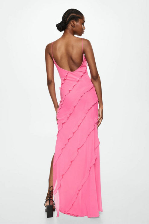 Back view of the pink V-neck ruffle side slit maxi dress, showing the low back and cascading ruffles.