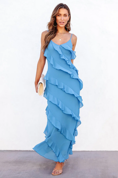 Flowing light blue V-neck ruffle maxi dress with a high side slit, showing movement.