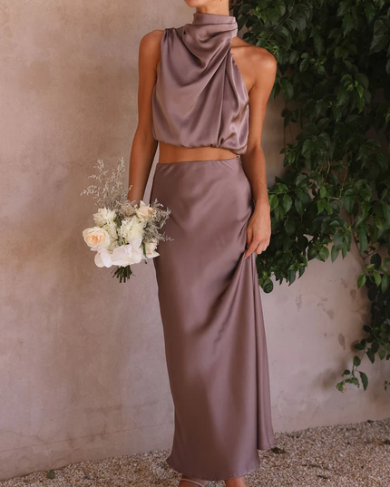 Front view of the taupe satin two-piece maxi set, with a high neck top and matching skirt, ideal for wedding guests.