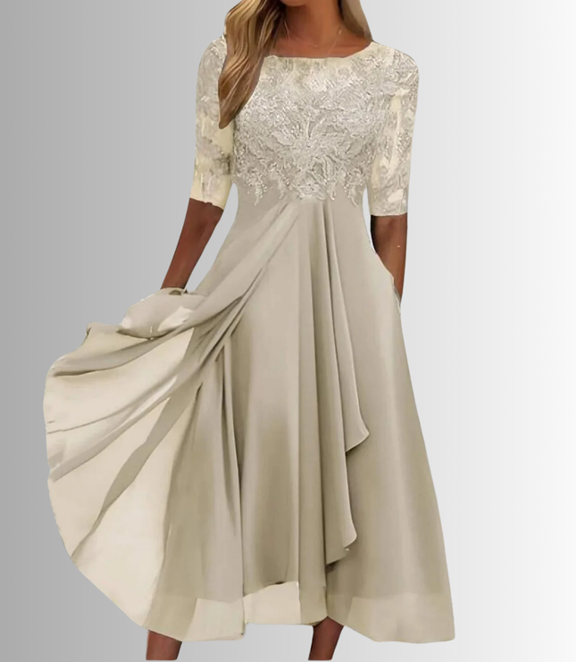 Light beige boat neck midi dress with detailed lace overlay on the bodice and sheer elbow sleeves, paired with a soft, flowing chiffon skirt with pockets, suitable for wedding attire.