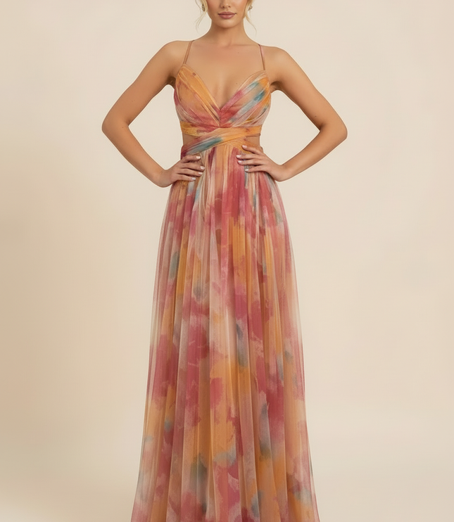 Front view of a women's printed V-neck sleeveless maxi dress, ideal for wedding guests, with hands on hips.