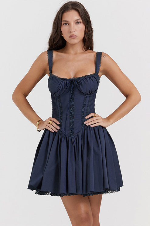 Full front view of a navy blue corset mini dress with a fitted bodice and a flared skirt, for a suit dress look.