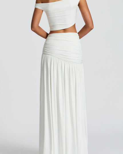 Back view of a women's white high waist ruched split maxi skirt, showcasing the full length and ruched detailing on the back.