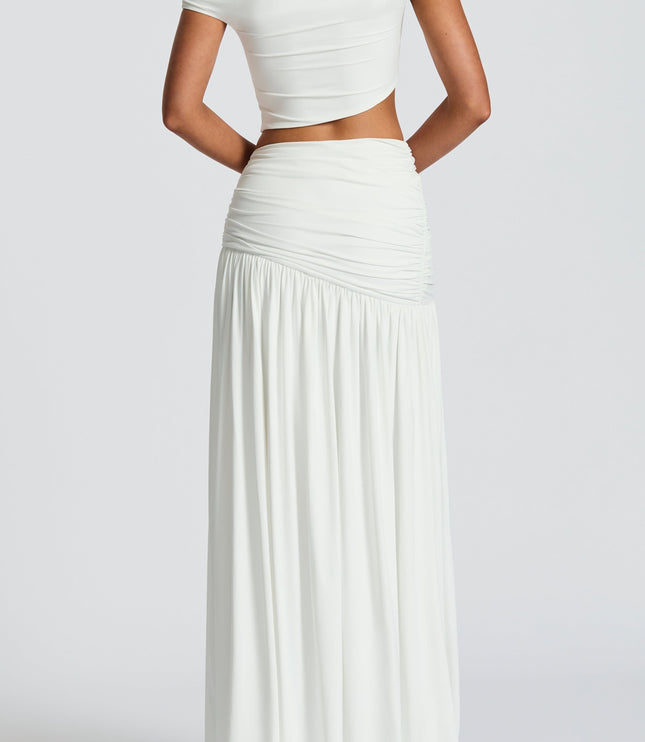 Back view of a women's white high waist ruched split maxi skirt, showcasing the full length and ruched detailing on the back.