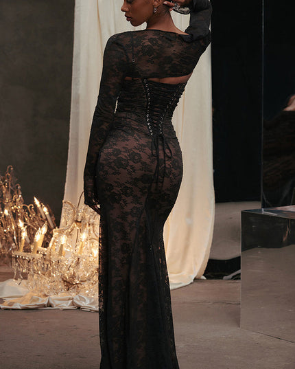 Back three-quarter view of the black lace maxi dress, emphasizing the form-fitting silhouette and intricate corset lacing.