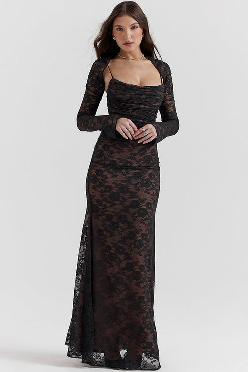 Front view of a black lace maxi dress with long sleeves and a sweetheart neckline, ruched bodice, and subtle floral pattern.