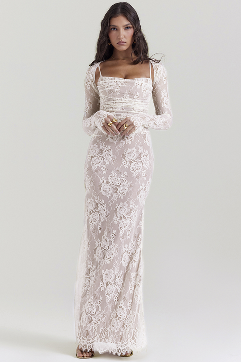 Full-length white lace corset back strapless maxi dress with long sleeve bolero, ruched bodice, and floral lace overlay.