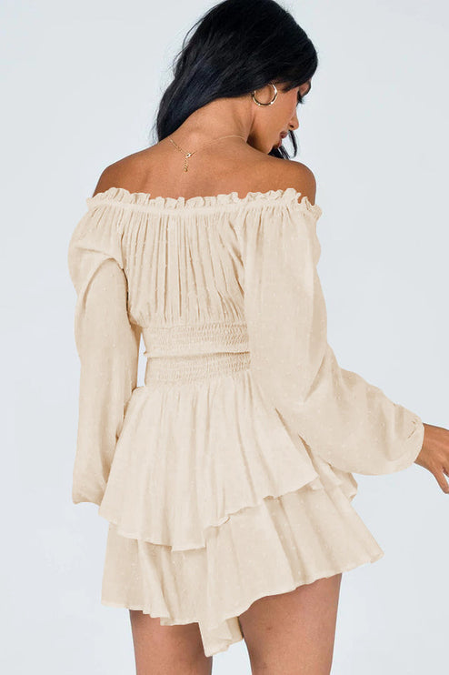 Back view of a women's off-shoulder mini dress in a light peach color with long sleeves and ruffled skirt