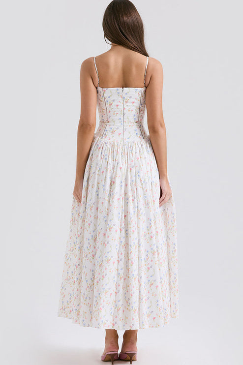 Back view of a white square neck sleeveless midi dress featuring a subtle floral pattern and a zipper closure.