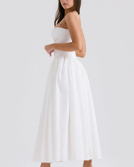 Side profile of women's white square neck midi dress, showing the structured bodice and voluminous skirt, with green heels.