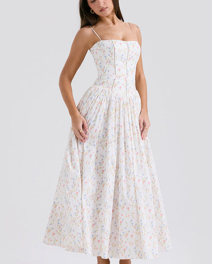 Front view of women's white floral square neck midi dress, showcasing the colorful small flower print and pleated skirt, with pink heels.