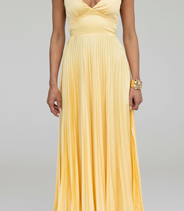 Close-up front view of a yellow V-neck pleated maxi dress, showcasing the bodice and skirt pleats.