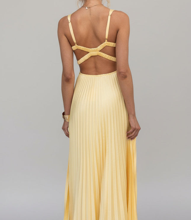 Full back view of the yellow V-neck pleated maxi dress, detailing the open back and criss-cross straps.