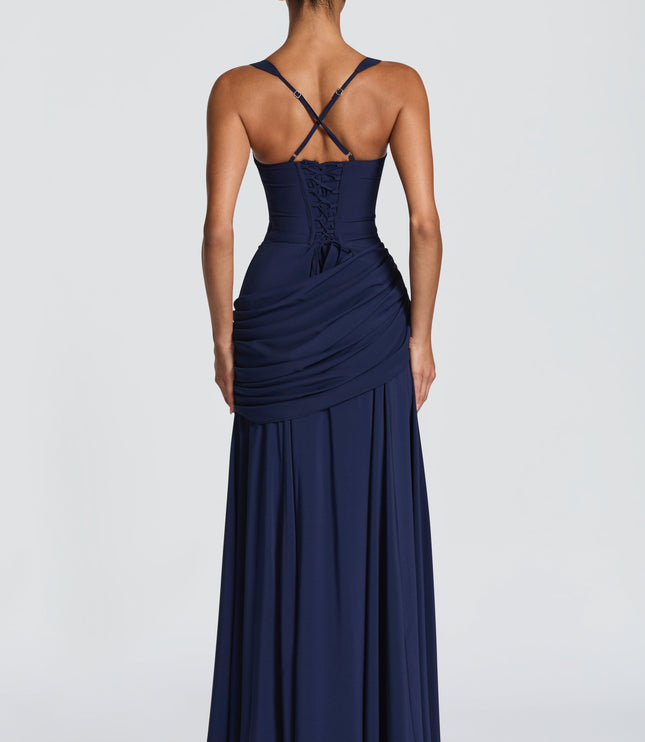 Back view of navy satin maxi dress with crisscross straps and lace-up corset detail