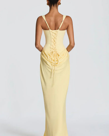 Pale yellow corset maxi dress with lace-up back and draped waist, back view