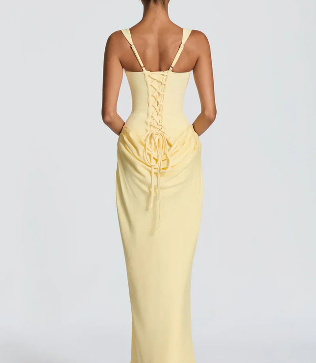 Pale yellow corset maxi dress with lace-up back and draped waist, back view
